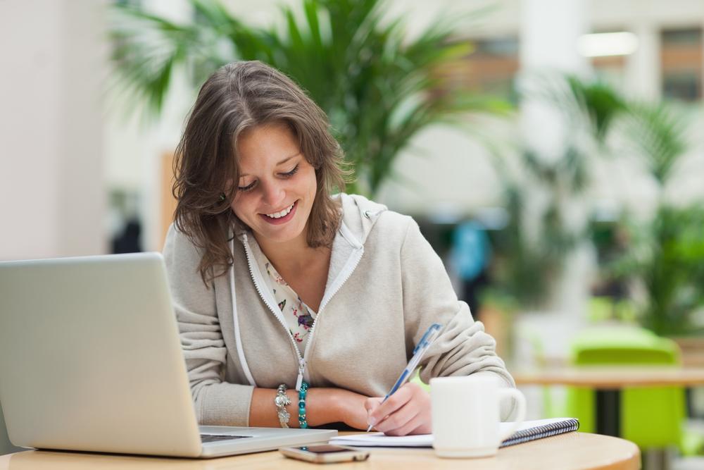 female student working on laptop